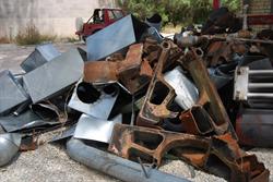 Pieces of the cast-iron boiler sits in a heap outside the Casino Star Theatre along with sections of sheet metal ducting. - , Utah